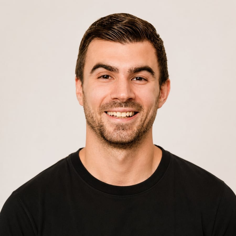 Headshot of Nate Bladecki, registered dietitian, smiling in a black t-shirt against a light background.
